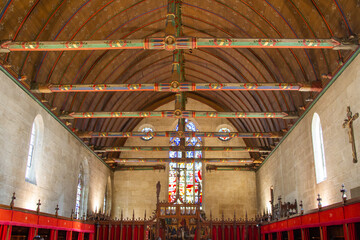 Beaune, France, April 16, 2022, Flamboyant Gothic style Hospices with Burgundy glazed tile roof....