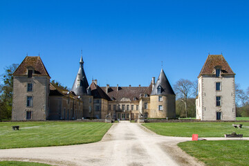Fototapeta na wymiar Commarin, France, April 17, 2022. The Chateau de Commarin is a regular and relatively symmetrical classically inspired building.