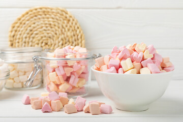 Marshmallow in a glass bowl on a white texture background.Rustic style.Gummous candy close-up.Snacks and snacks for parties.Spice for coffee and cocoa.Winter food concept.Place for text.Place for copy