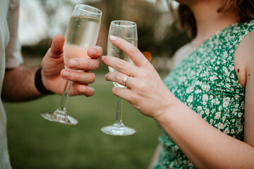 person holding a glass of champagne
