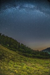 Plakat Mountain landscape with starry sky and milky way