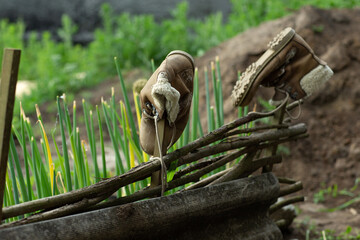 wicker willow fence with boots