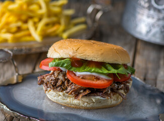 Spicy crispy Beef Shawarma Burgerserved in dish side view on wooden table background