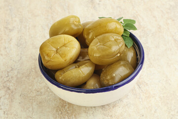 Pickled green tomato in the bowl