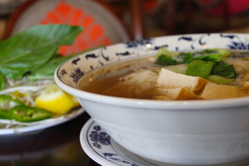 Tofu floats in vietnamese pho soup