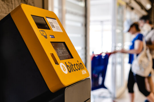 ATM machine for payment by Bitcoin cryptocurrency - Powered by Adobe