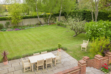 Garden patio terrace with furniture in UK back garden