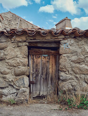 Old, picturesque main front door in mediterranean region house