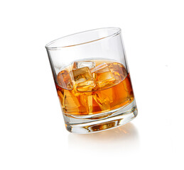 whiskey glass with ice on white