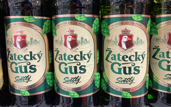 Erkelenz, Germany - June 9. 2022: Closeup of russian Zatecky Gus beer bottles in shelf of german supermarket