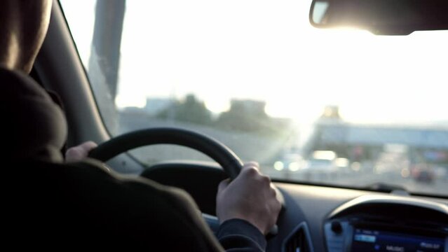 Man driving a car while driving.