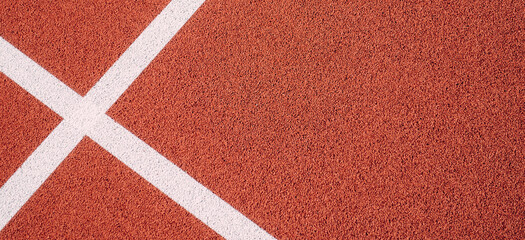 Fototapeta na wymiar Colorful sports court background. Top view to red field rubber ground with white lines outdoors