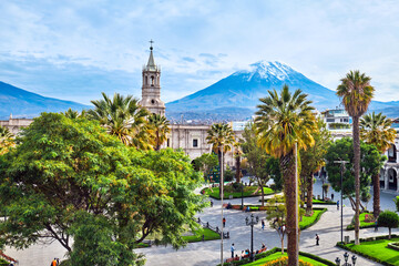 Arequipa, Peru. The main square of the city and a view of the Andes. - obrazy, fototapety, plakaty