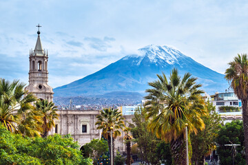 Tower on the background of a volcano in Arequipa, Peru. - 512432340
