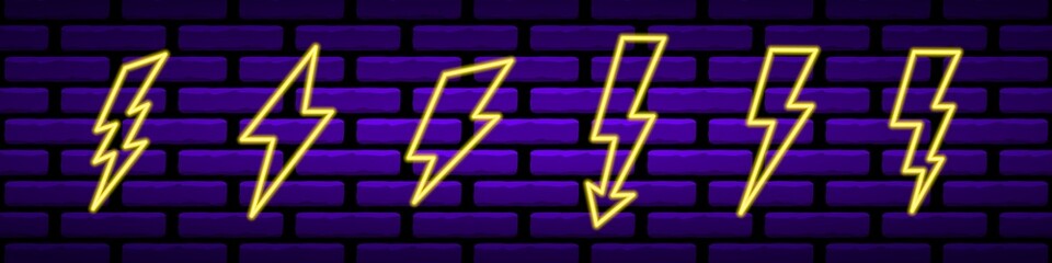 Neon yellow lightning bolts set. Glowing electrical flashes with geometric curves high voltage hazard and powerful vector thunderstorm discharges.