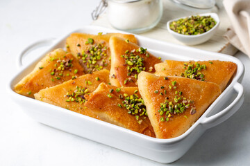 Traditional Turkish desserts; custard triangular dessert, albanian dessert ( Turkish name; Arnavut tatlisi or muhallebili muska tatlisi)