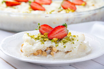Close-up walnut gullac dessert. Traditional Ramadan dessert. Middle Eastern desserts.