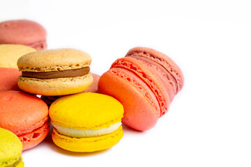 Colorful macaroon cakes. Small french muffins. Colorful macarons on a white background