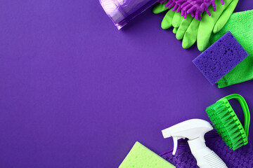 House cleaning service banner design. Flat lay cleaning supplies and chemicals on purple background.