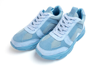 Light blue sneakers on a white background. Sports shoes
