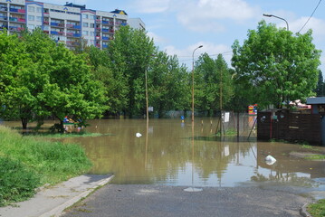 Wrocław, Kozanów housing estate, flood of May 2010. You can see residential buildings, water on the street, flooded city.