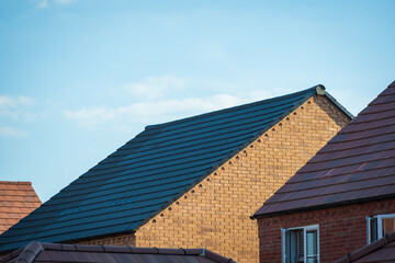 new built houses over clear blue sky in england uk
