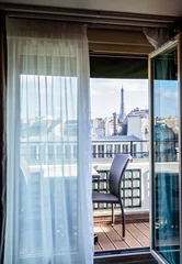 Meubelstickers Cosy Paris hotel room with balcony and beautiful view at Eiffel tower and city © Tetiana Soares