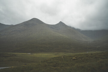 Fototapeta premium Mists rolling over large mountains