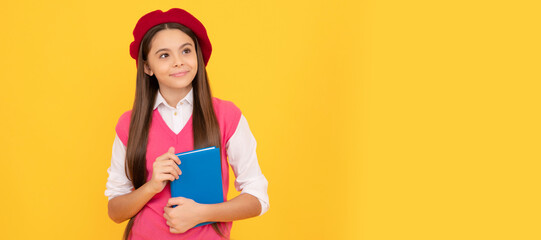 happy teen school girl in french beret hold copybook on yellow background, literature. Banner of school girl student. Schoolgirl pupil portrait with copy space.
