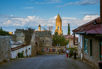 Street of old town with church