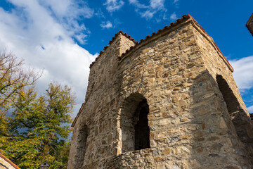 Fototapeta na wymiar Ancient Georgian Orthodox monastery under blue sky