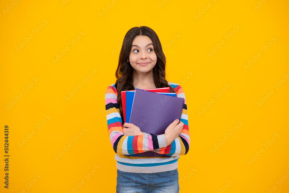 Wall mural back to school. teenager schoolgirl with book ready to learn. school girl children on isolated yello