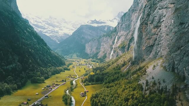 Lauterbrunnen town in Swiss Alps valley, Switzerland. Big waterfalls