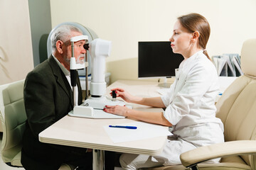 ophthalmologist examination of elderly man on corneo topographer.modern clinic