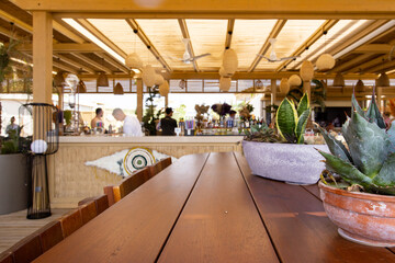 Table empty background in cafe ,restaurant background.Front view. . Dining table. Brochure background.Bar outside in summer vacation 