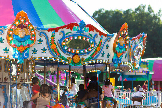 Merry-go-round ride at the fair in summertime