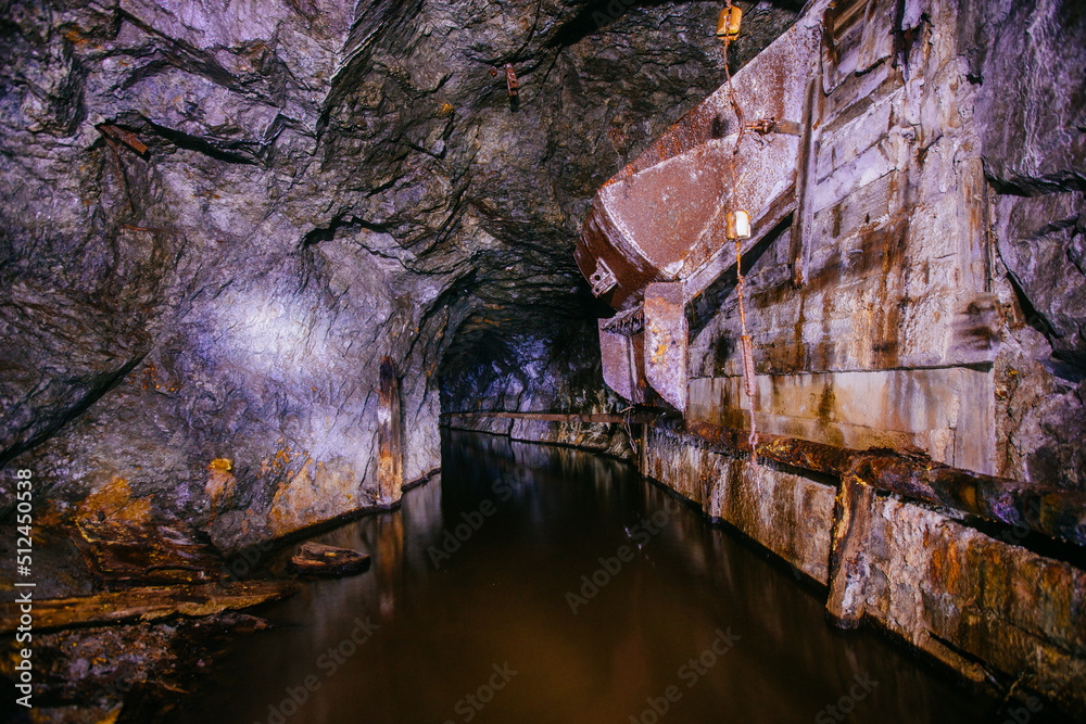 Wall mural Dark flooded abandoned mine tunnel - Wall murals