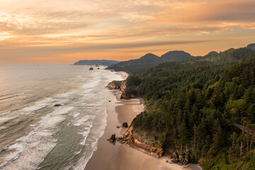 Aerial Drone View of the Oregon Coast Near Cannon Beach at Sunset. Shot from Arch Cape the view extends all the way to Cannon Beach and Haystack Rock.