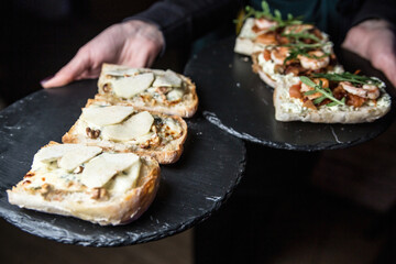 Bruschetta with pear, blue cheese and nuts