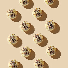 Ice cream balls pattern with copy space on a pastel beige background. Summertime, dessert minimal...