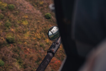 mirror on base of helicopter flying