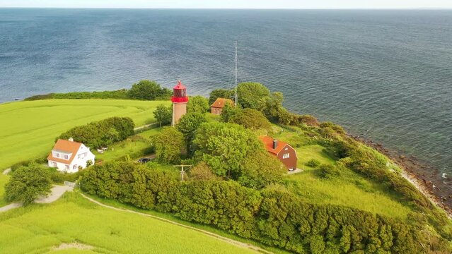 View of beautiful nature landscape of Baltic sea coast.View of the lighthouse on the Staberhuk cliffs on the island of Fehmarn, Germany, Europe.