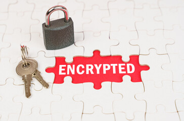 On puzzles there is a lock and keys, on a red surface there is an inscription - encrypted