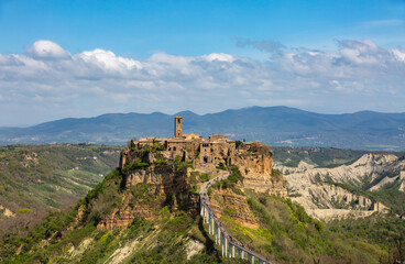 Fototapeta na wymiar Panoramic aerial view of Civita di Bagnoregio with a view of the Calanchi Valley, Lazio, Bagnoregio, province of Viterbo.The most beautiful villages in Italy.The dying city