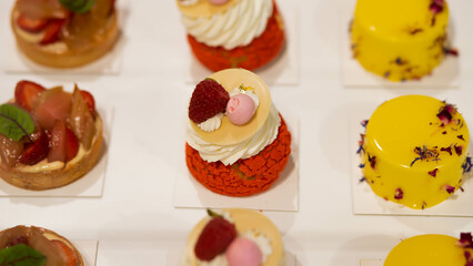 cake with strawberry and raspberry flavor poured over with red velvet and decorated with fruits and chocolate, as well as fruit soufflé. Photography for restaurants and cafes. Advertising cafe with ca