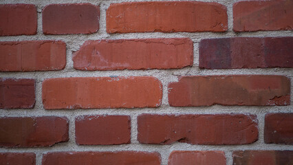 Obraz premium Red brick wall texture background. Old weathered surface. The concept of erosion.