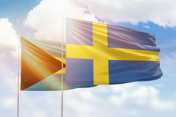 Sunny blue sky and flags of sweden and bahamas