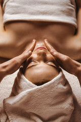 Close-up of cosmetologist making rejuvenating face procedures for woman client in spa or salon....