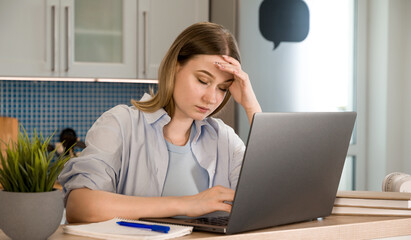 Closeup of a tired female with headache.Burnout at work or college