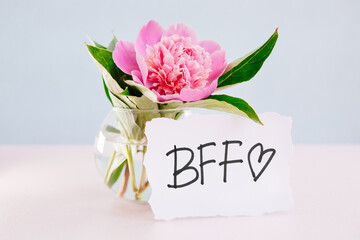 BFF - best friends forever card with lettering and peony flowers, friendship concept
